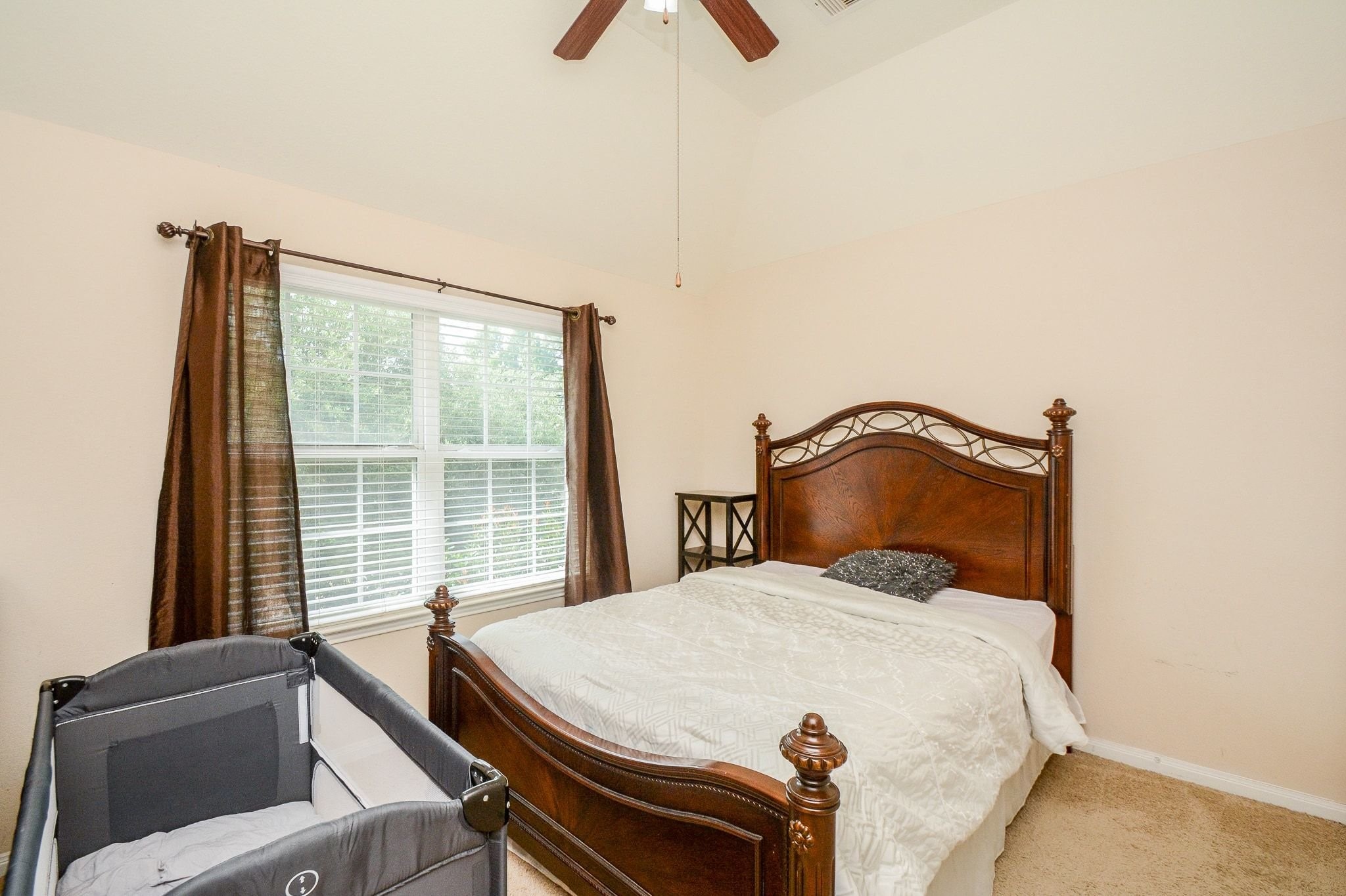 7046 Sliding Rock Circle Spring, TX 77379 - Photo 24 of 41 Upstairs Bedroom: Cozy and bright, with ample natural light and a serene ambiance.