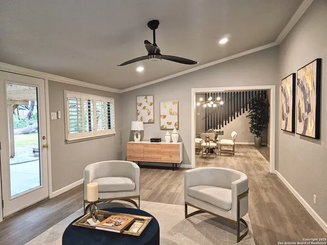 a living room with furniture and a large window