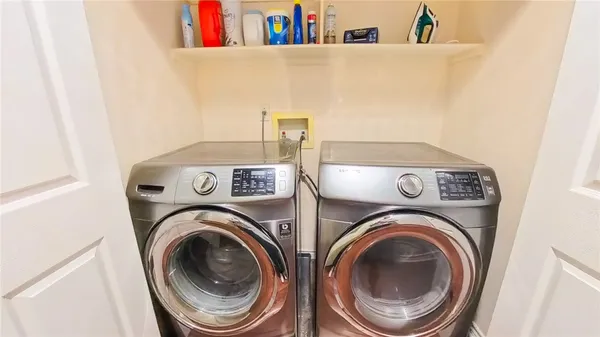 a utility room with dryer and washer