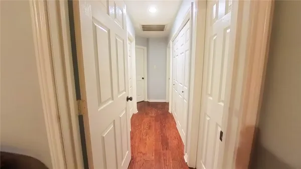 a view of a bathroom with a sink and a mirror