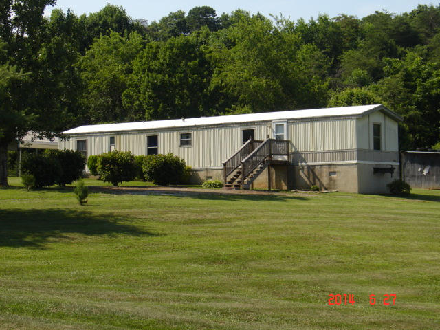 104 Ramblin Rose Road Vinton, VA 24179 - Photo 10 of 14 a view of a small house in the background
