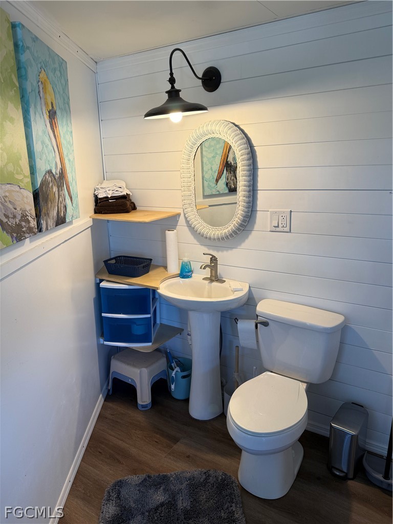 19681 Summerlin Road, Unit 482 Fort Myers, FL 33908 - Photo 23 of 35 a bathroom with a toilet a sink and a mirror