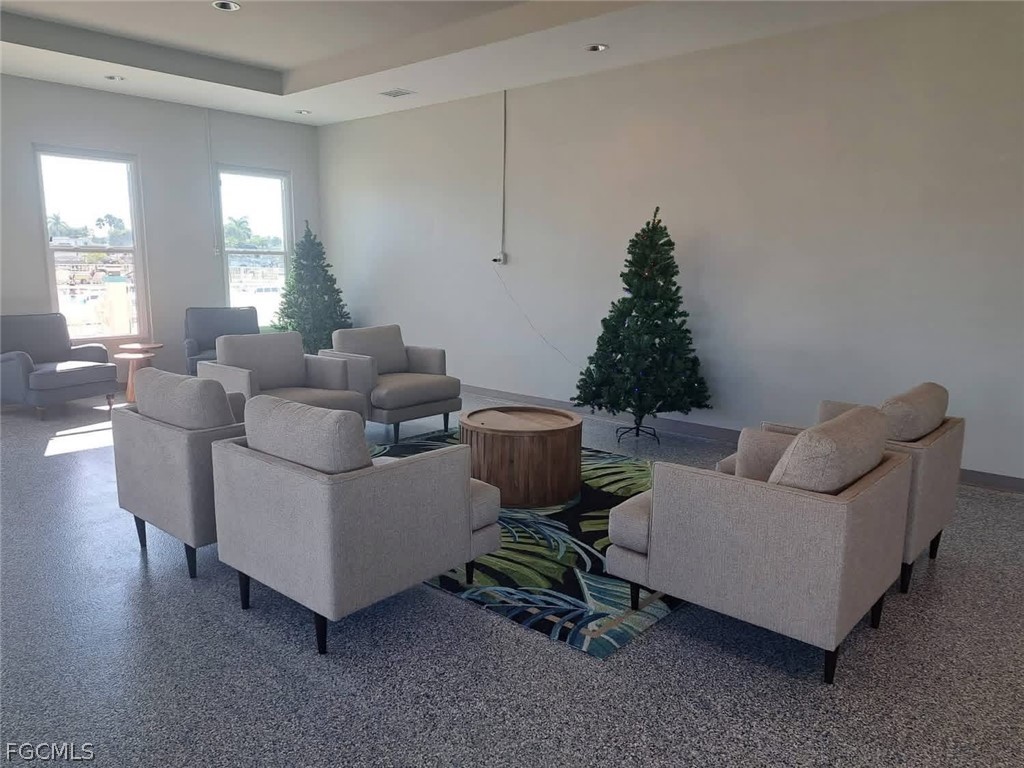 19681 Summerlin Road, Unit 482 Fort Myers, FL 33908 - Photo 31 of 35 a living room with furniture and a window