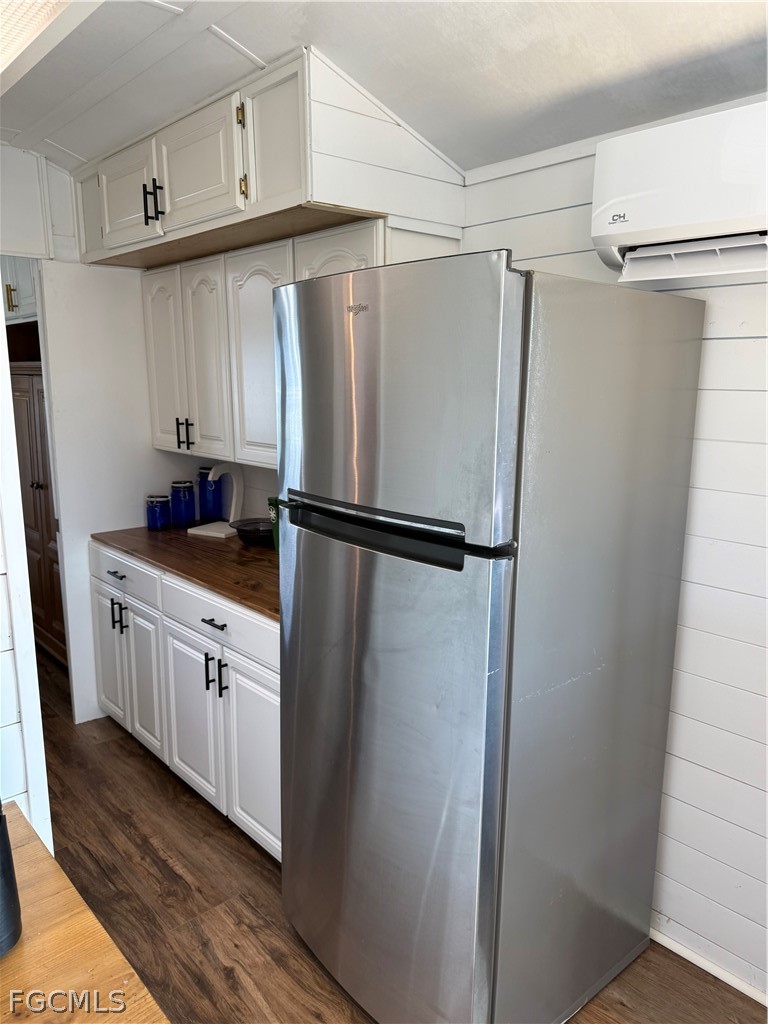 19681 Summerlin Road, Unit 482 Fort Myers, FL 33908 - Photo 5 of 35 a kitchen with white cabinets and refrigerator