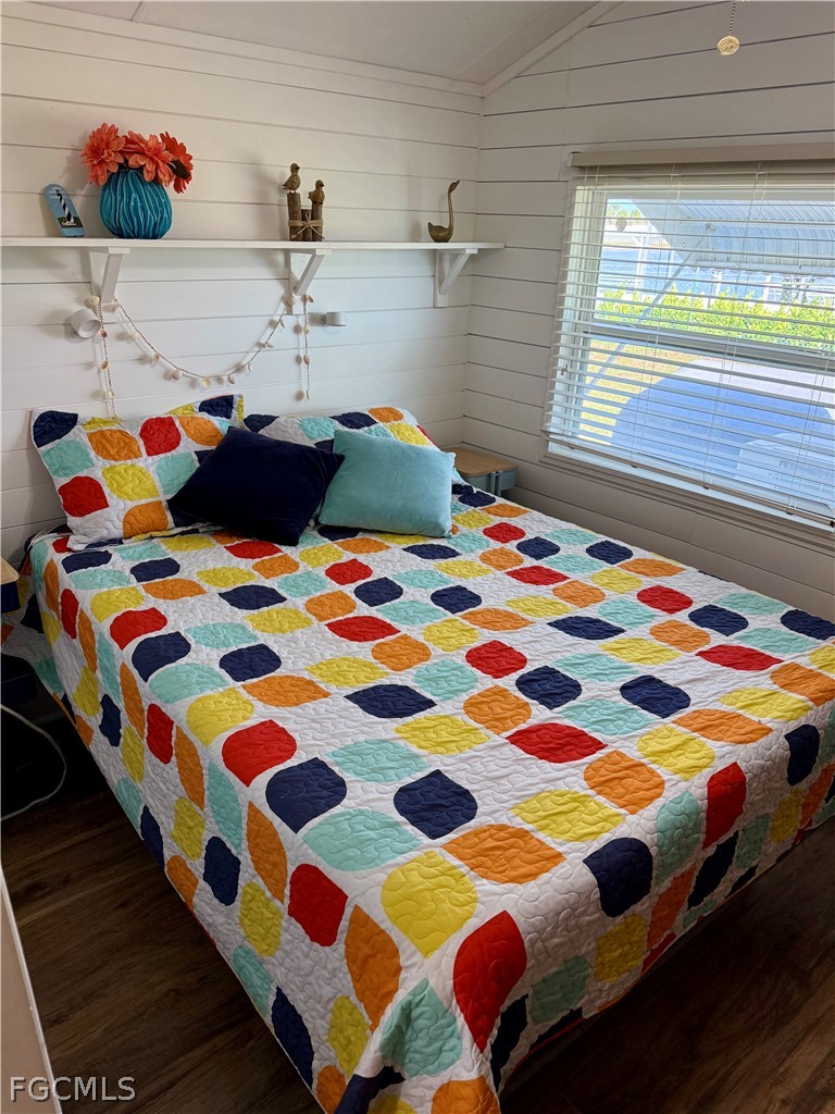 19681 Summerlin Road, Unit 482 Fort Myers, FL 33908 - Photo 10 of 35 a bedroom with a bed and a small window