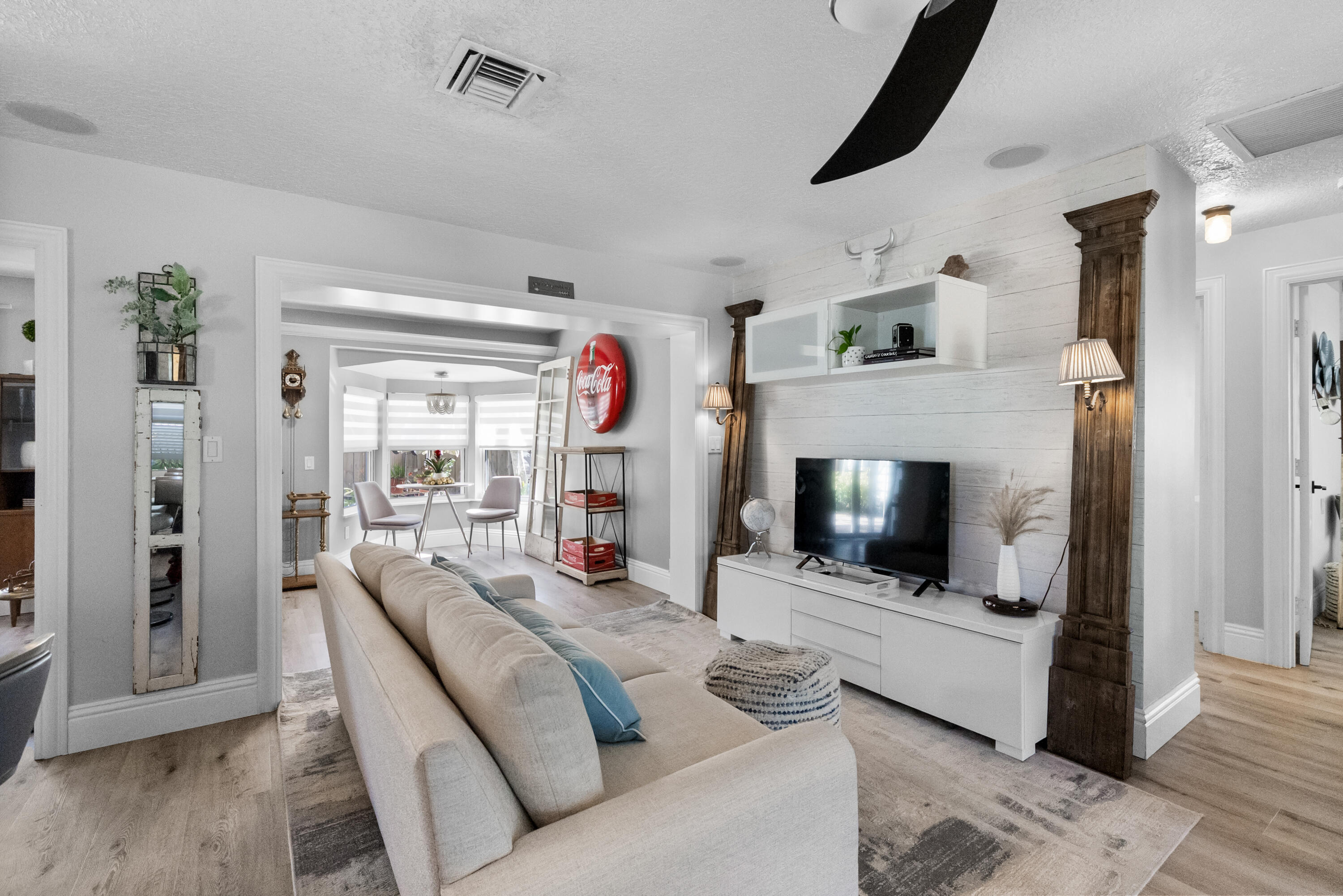 1605 Treemont Avenue Jupiter, FL 33469 - Photo 17 of 35 a living room with furniture and a fireplace