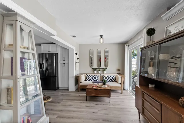 a view of living room and kitchen with furniture