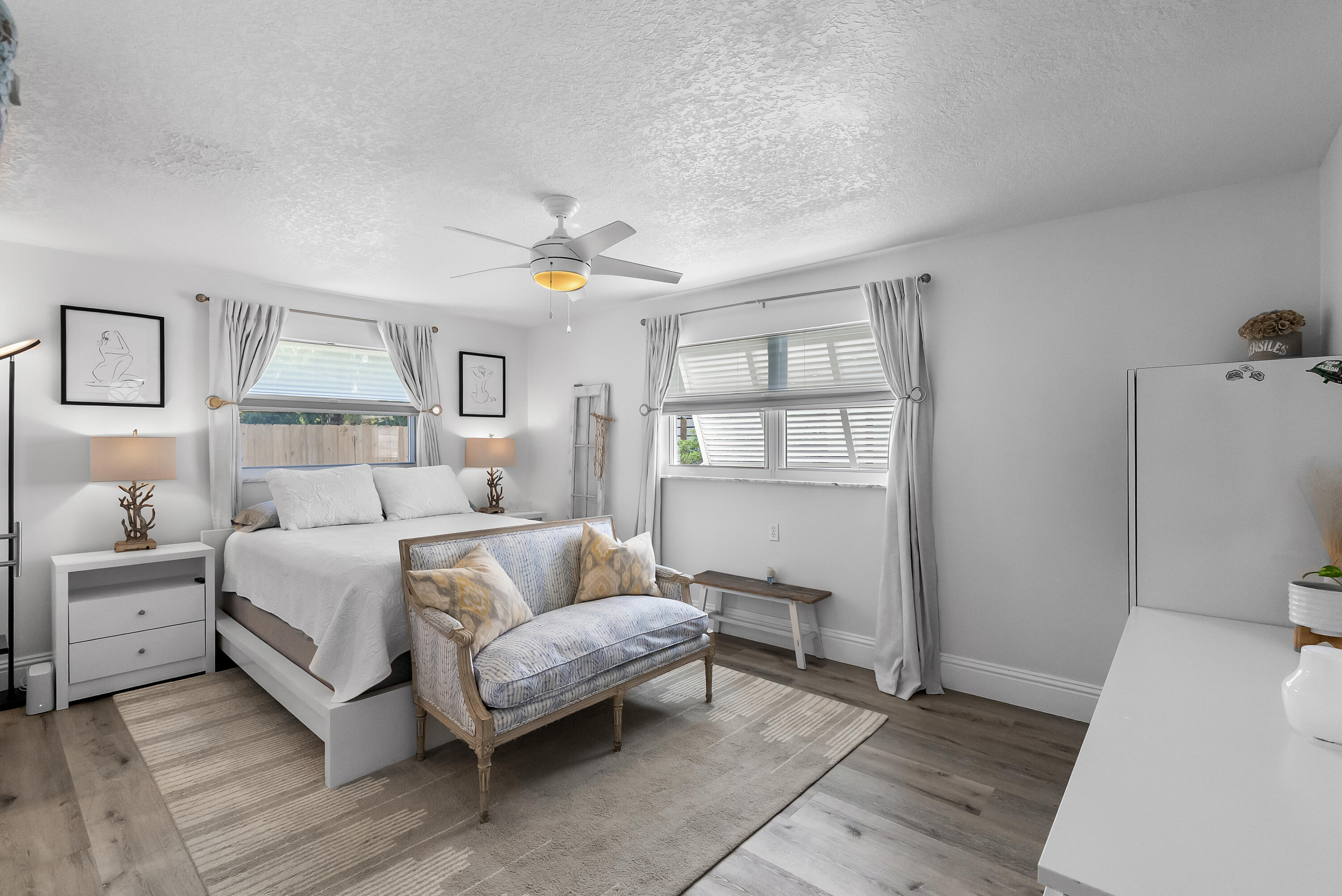 1605 Treemont Avenue Jupiter, FL 33469 - Photo 22 of 35 a bedroom with a bed and a table