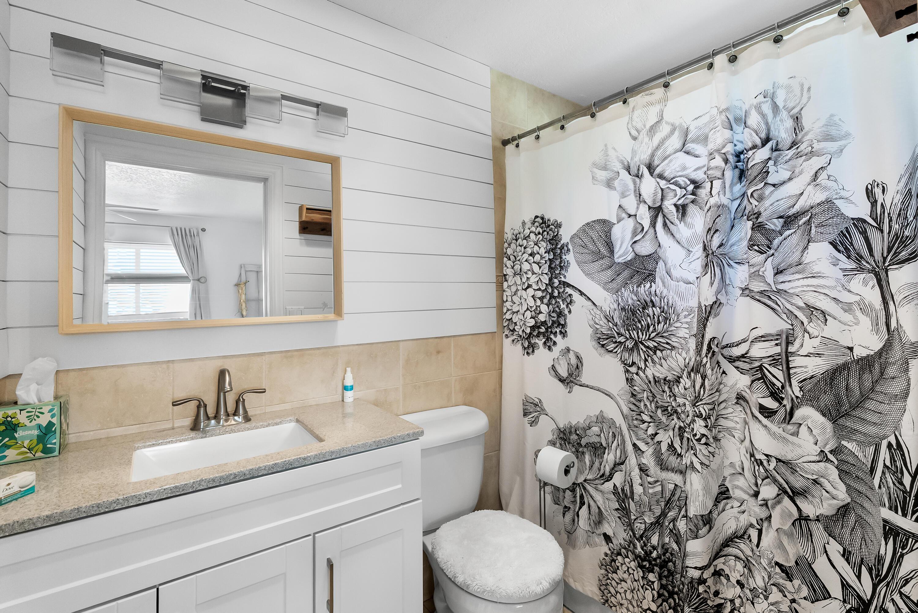 1605 Treemont Avenue Jupiter, FL 33469 - Photo 25 of 35 a bathroom with a granite countertop sink and a toilet