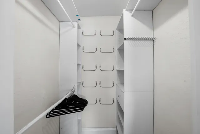 a bedroom with furniture and a chandelier