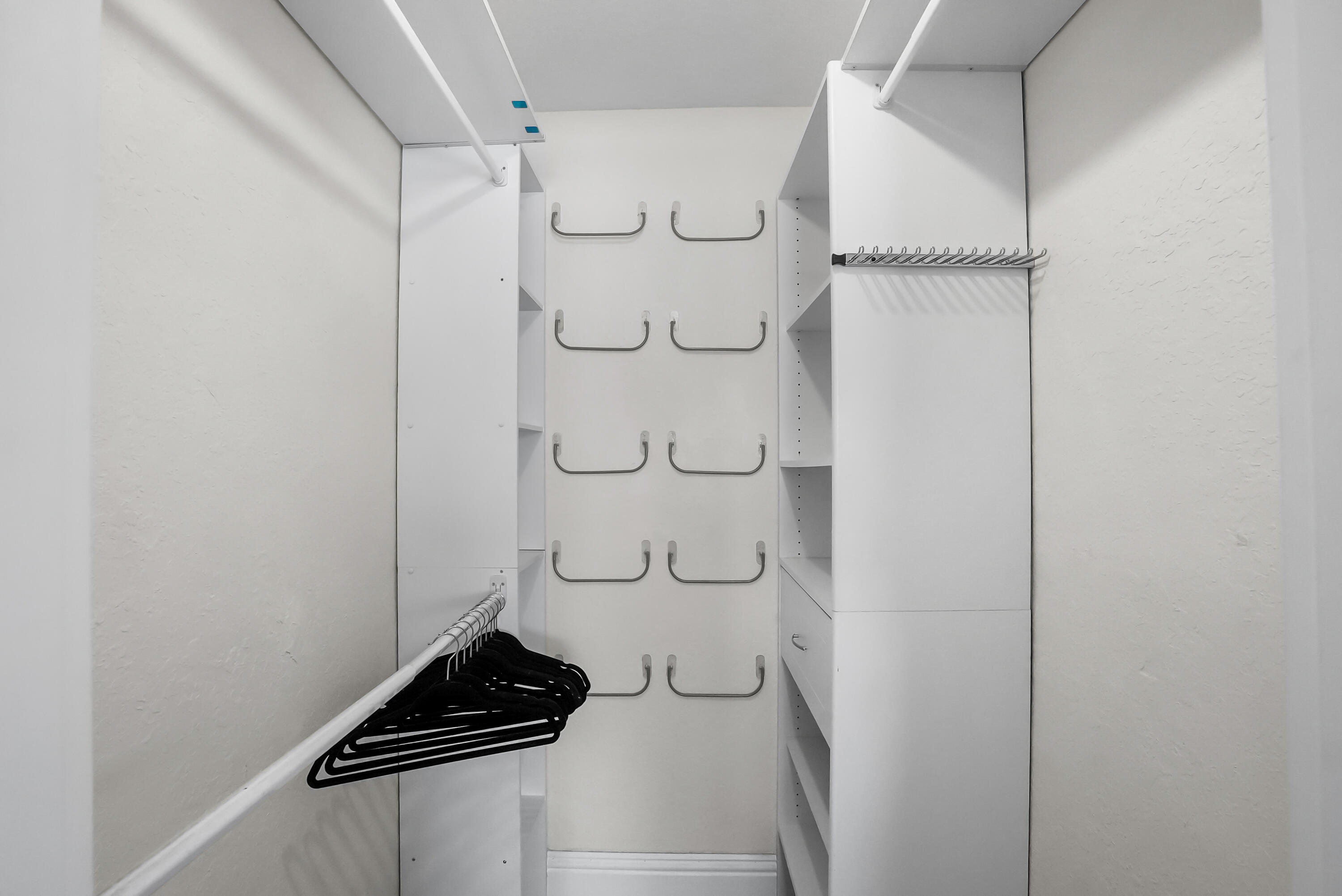 1605 Treemont Avenue Jupiter, FL 33469 - Photo 26 of 35 a bathroom with a glass shower door