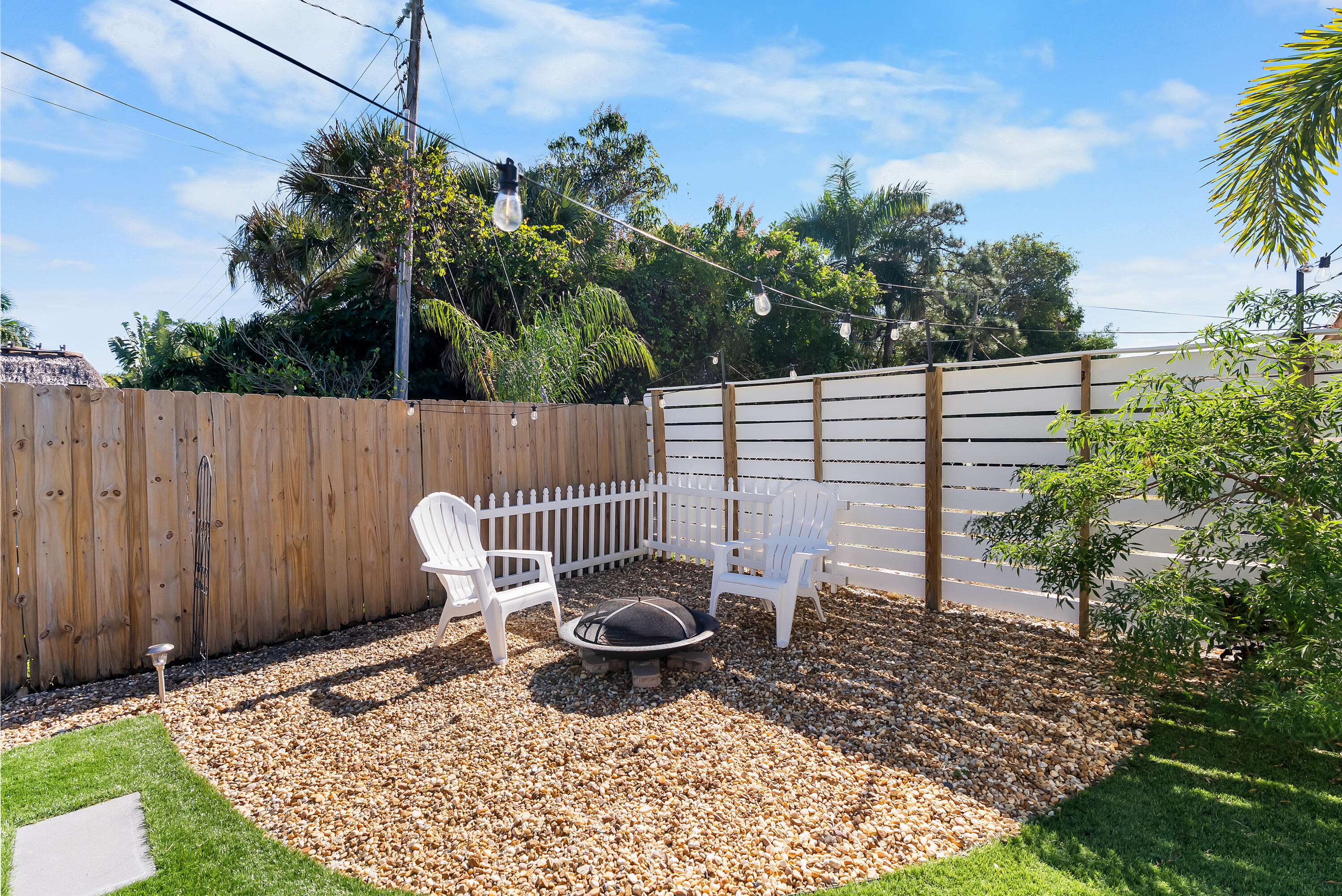 1605 Treemont Avenue Jupiter, FL 33469 - Photo 30 of 35 a view of a backyard with sitting area