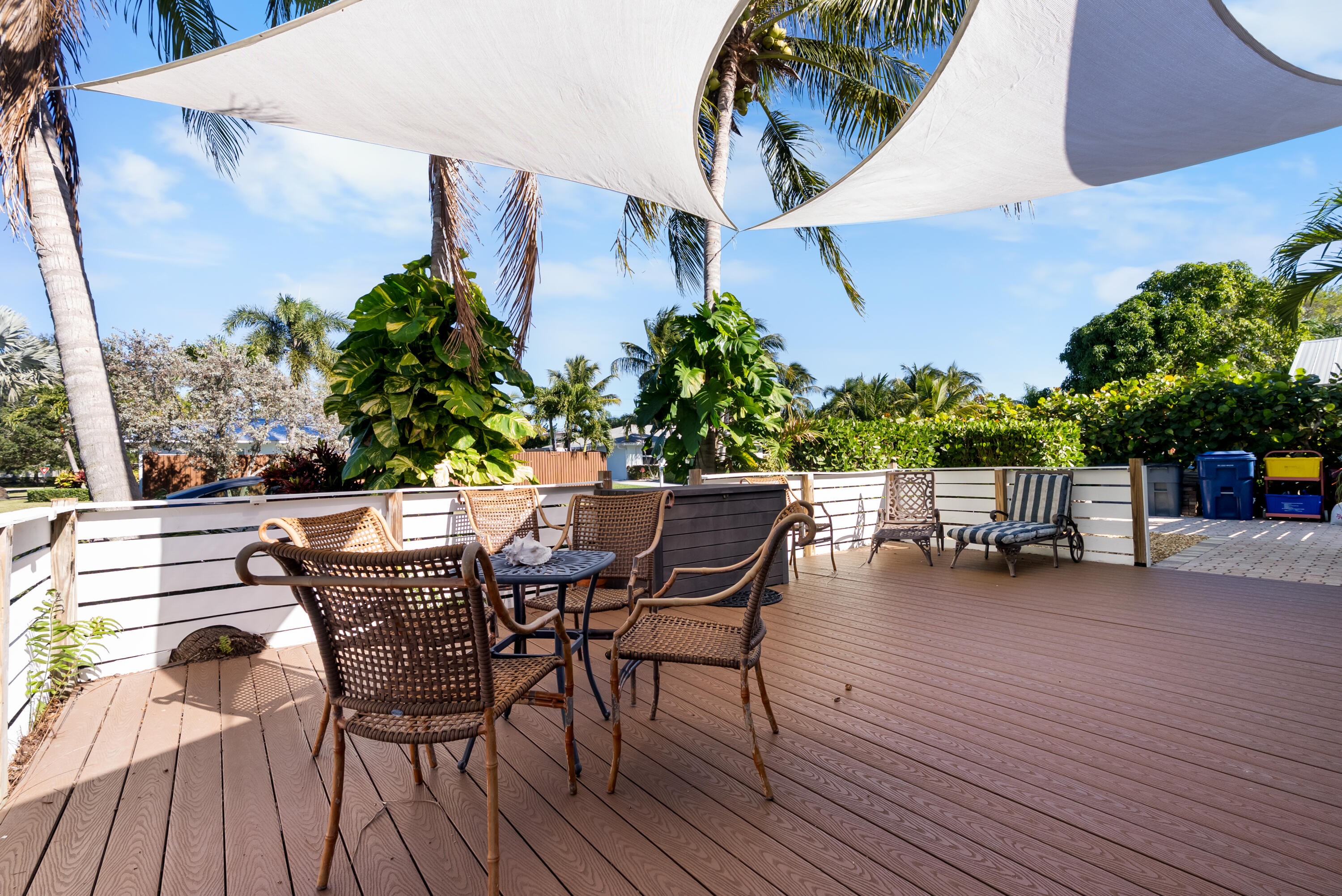 1605 Treemont Avenue Jupiter, FL 33469 - Photo 34 of 35 a view of outdoor dining space with furniture and wooden floor