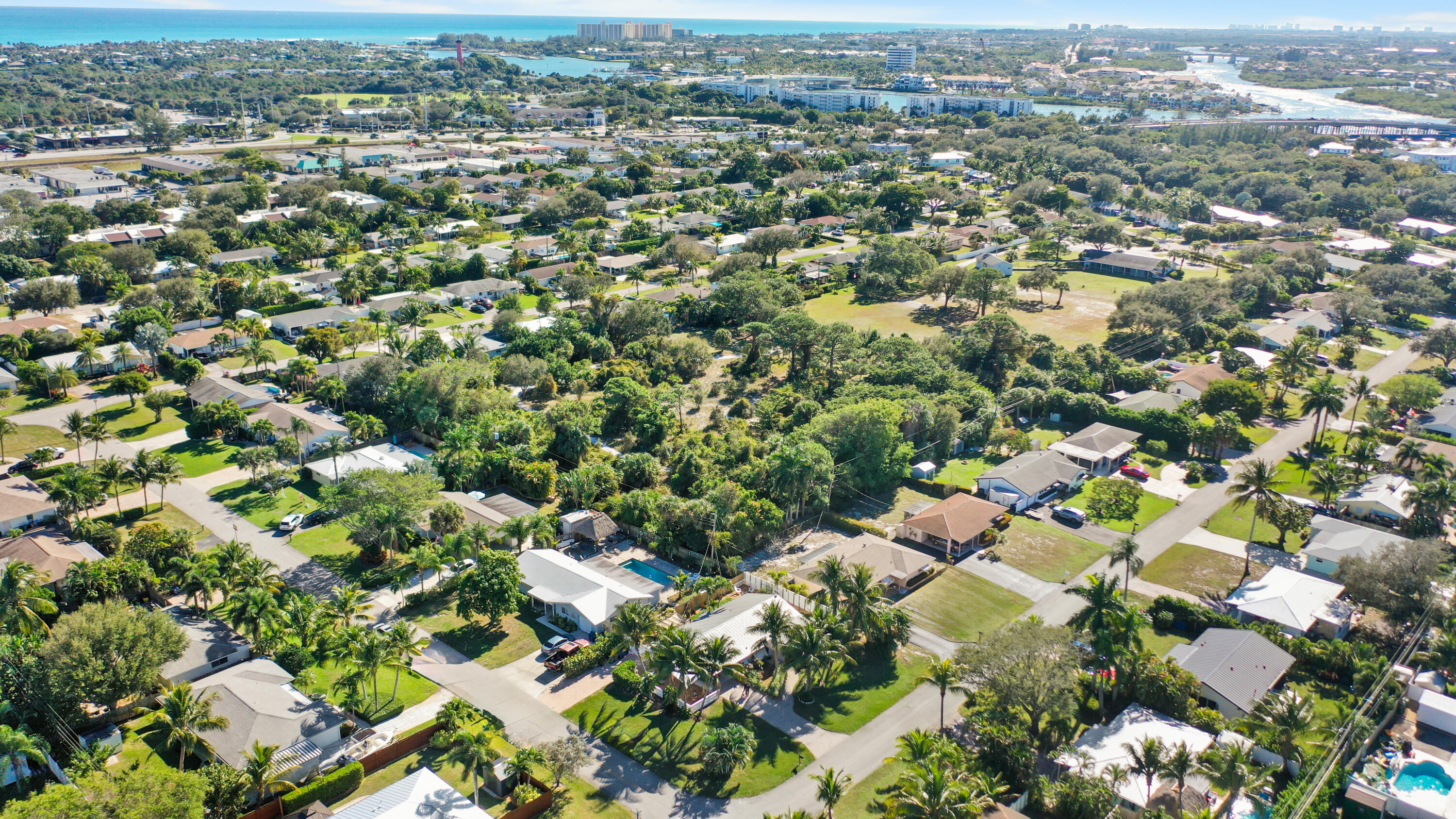 1605 Treemont Avenue Jupiter, FL 33469 - Photo 7 of 35 an aerial view of residential houses with city view