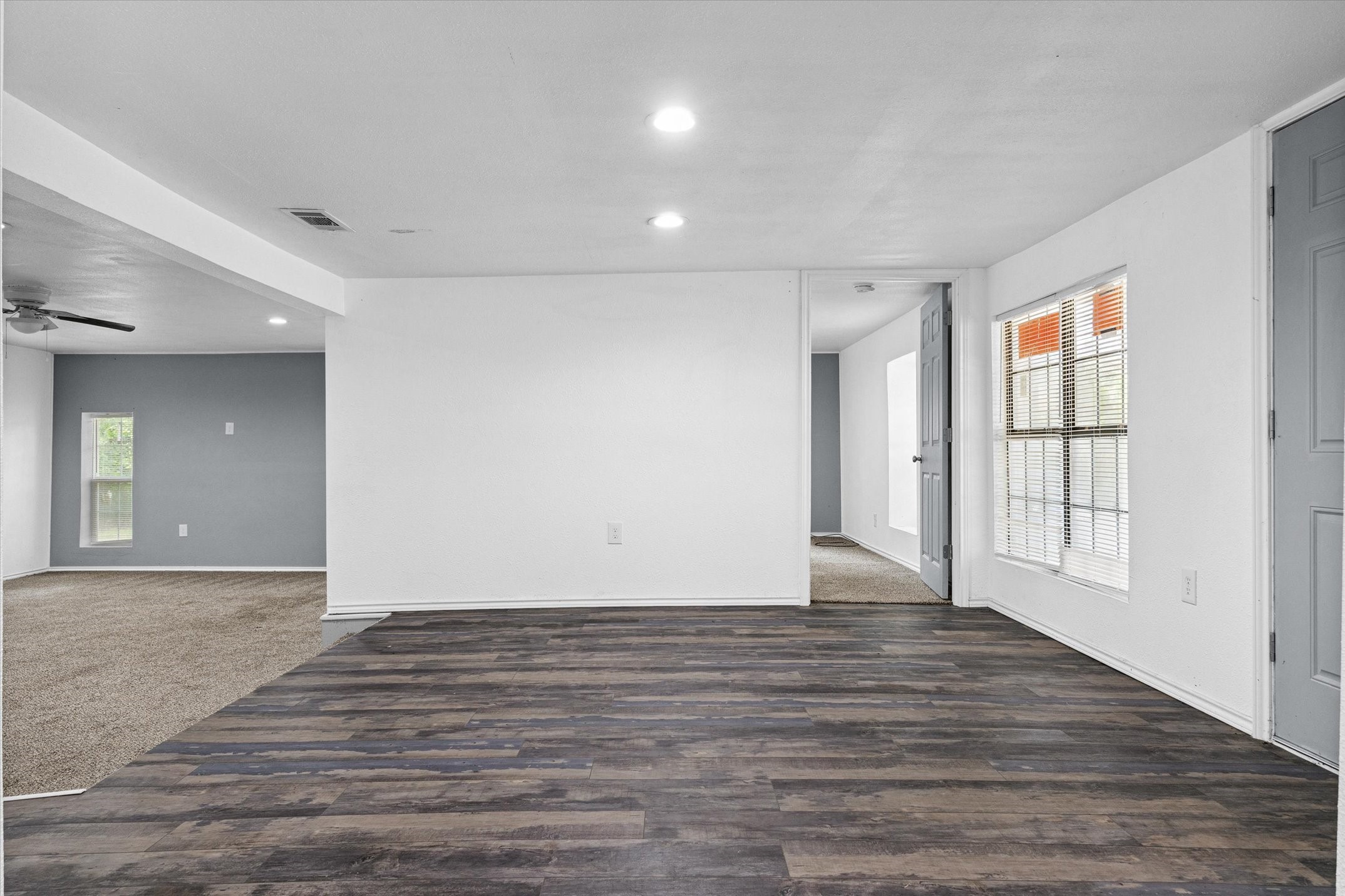 410 Pleasure Land Road Gun Barrel City, TX 75156 - Photo 11 of 33 a view of an empty room with wooden floor and a window
