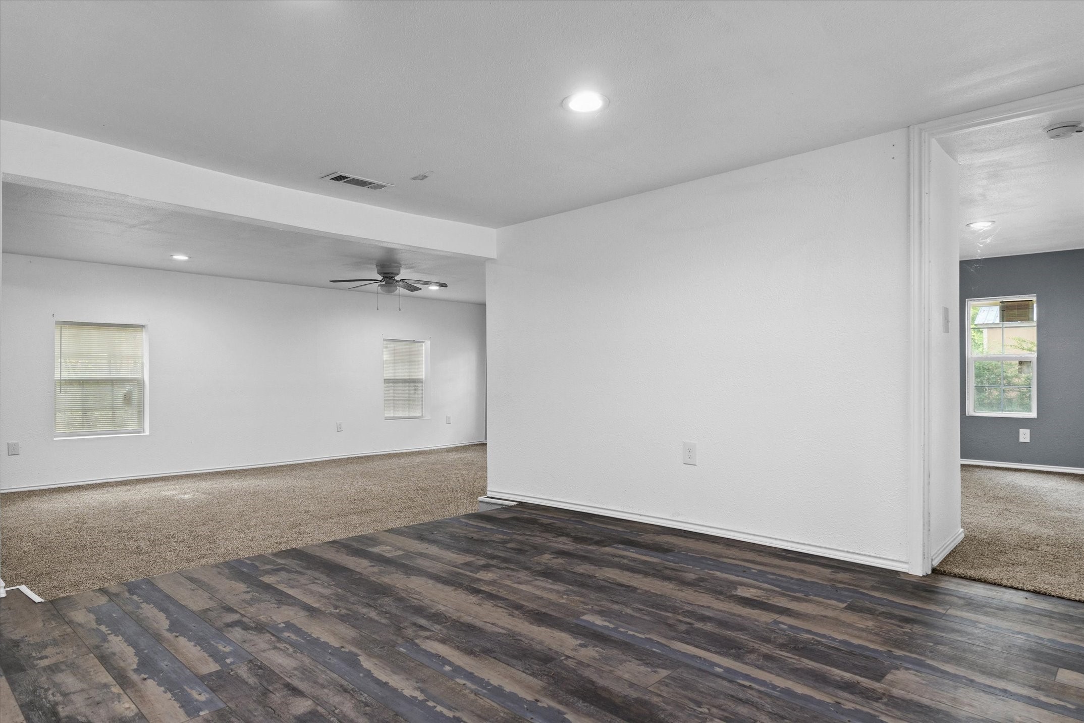 410 Pleasure Land Road Gun Barrel City, TX 75156 - Photo 12 of 33 an empty room with wooden floor and windows