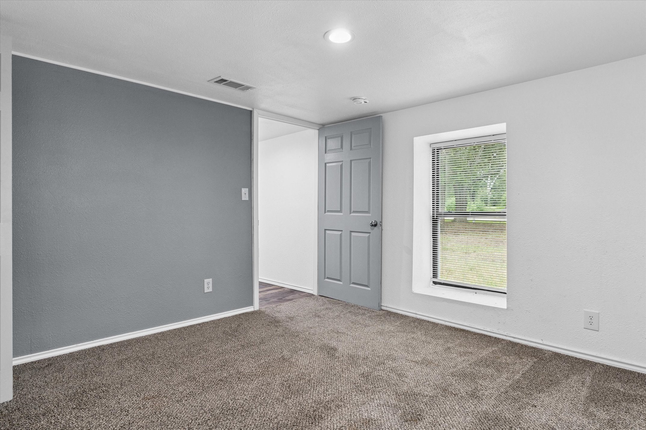 410 Pleasure Land Road Gun Barrel City, TX 75156 - Photo 17 of 33 an empty room with windows