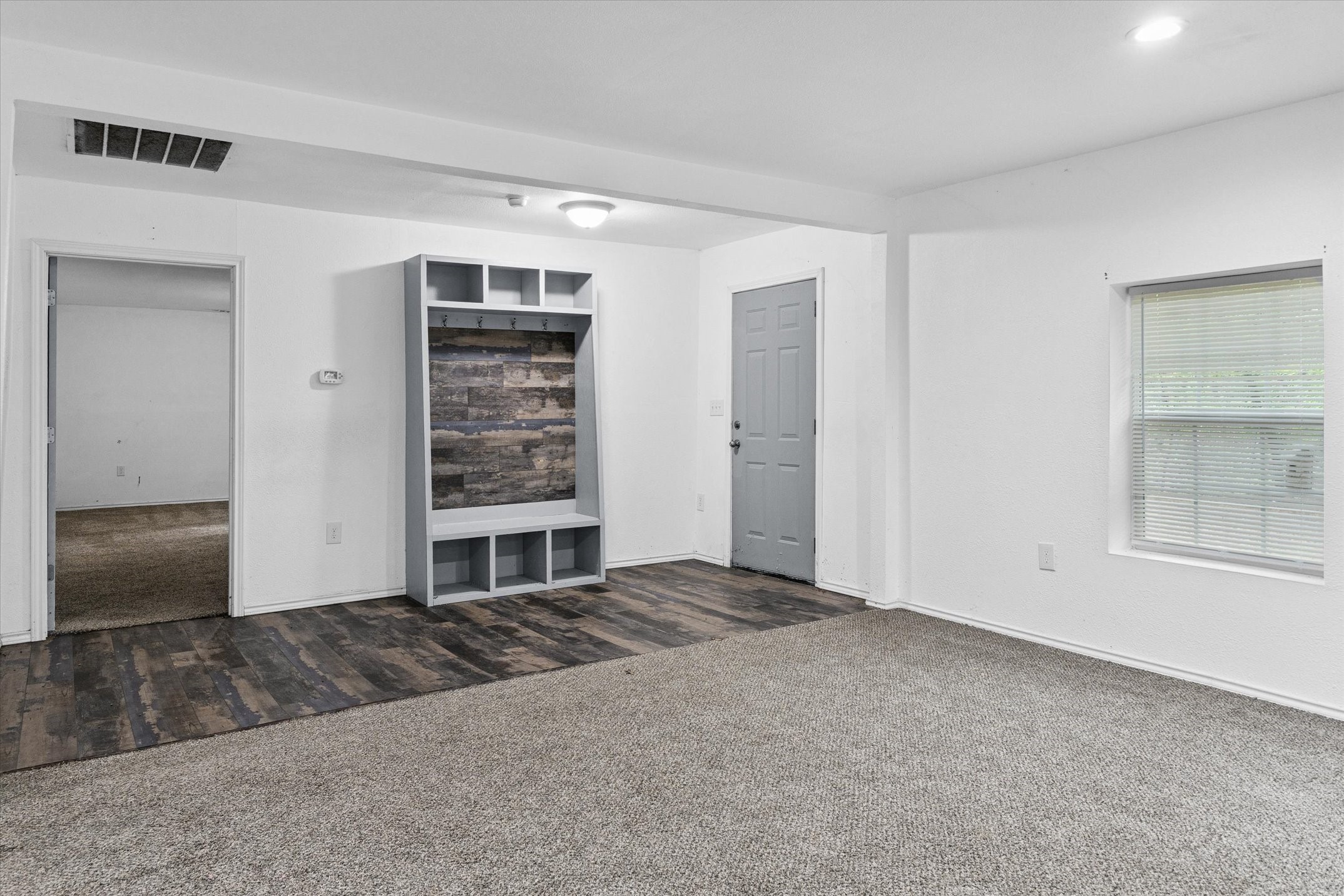 410 Pleasure Land Road Gun Barrel City, TX 75156 - Photo 19 of 33 a view of an empty room with window and cabinet