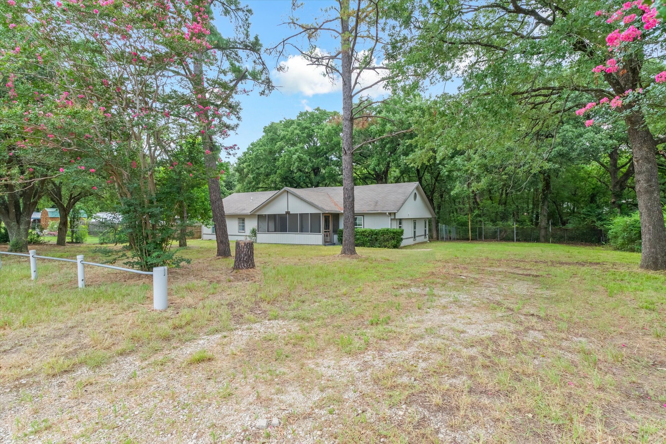 410 Pleasure Land Road Gun Barrel City, TX 75156 - Photo 2 of 33 a house view with a backyard space