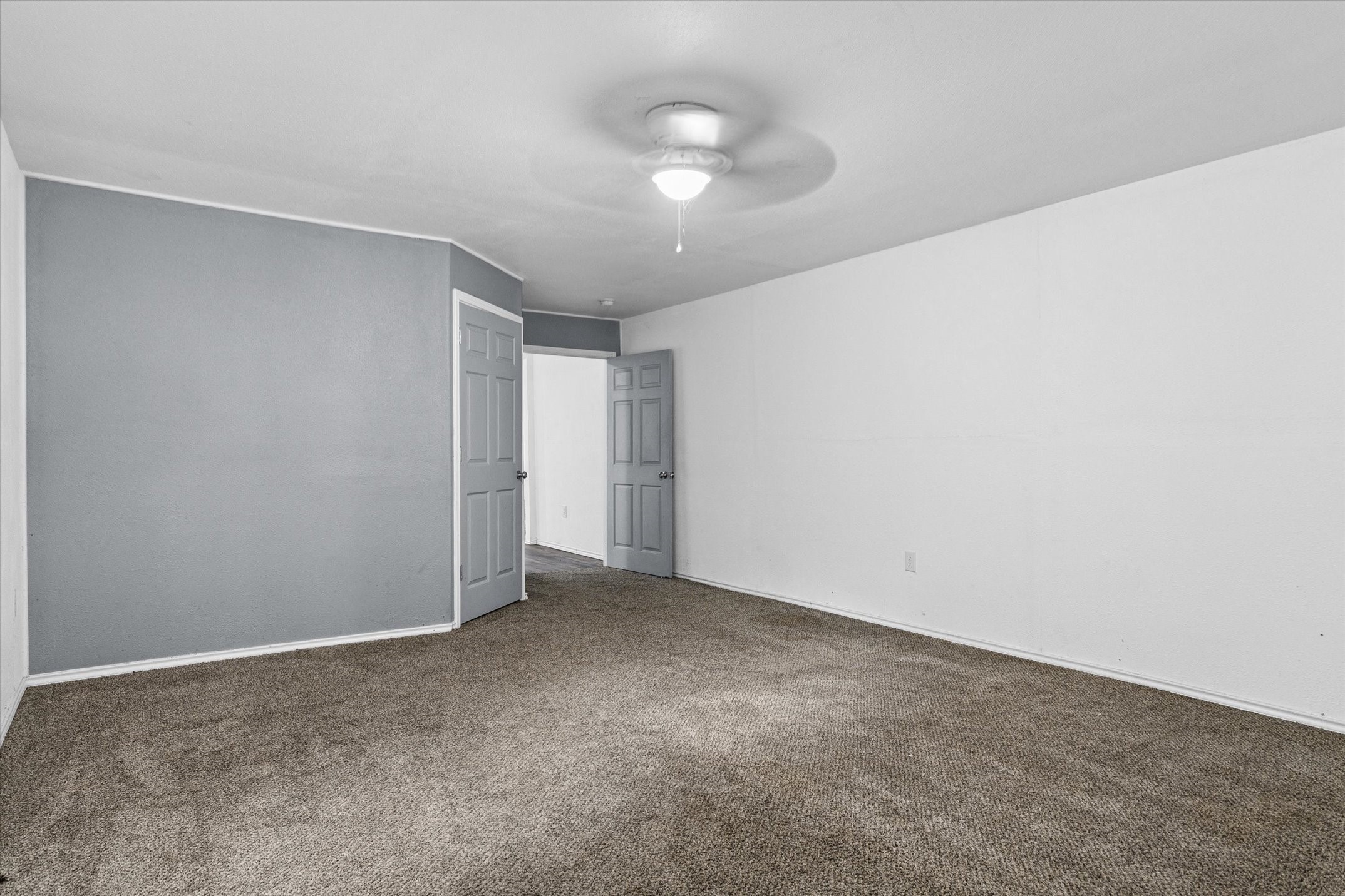 410 Pleasure Land Road Gun Barrel City, TX 75156 - Photo 23 of 33 a view of an empty room with a chandelier fan