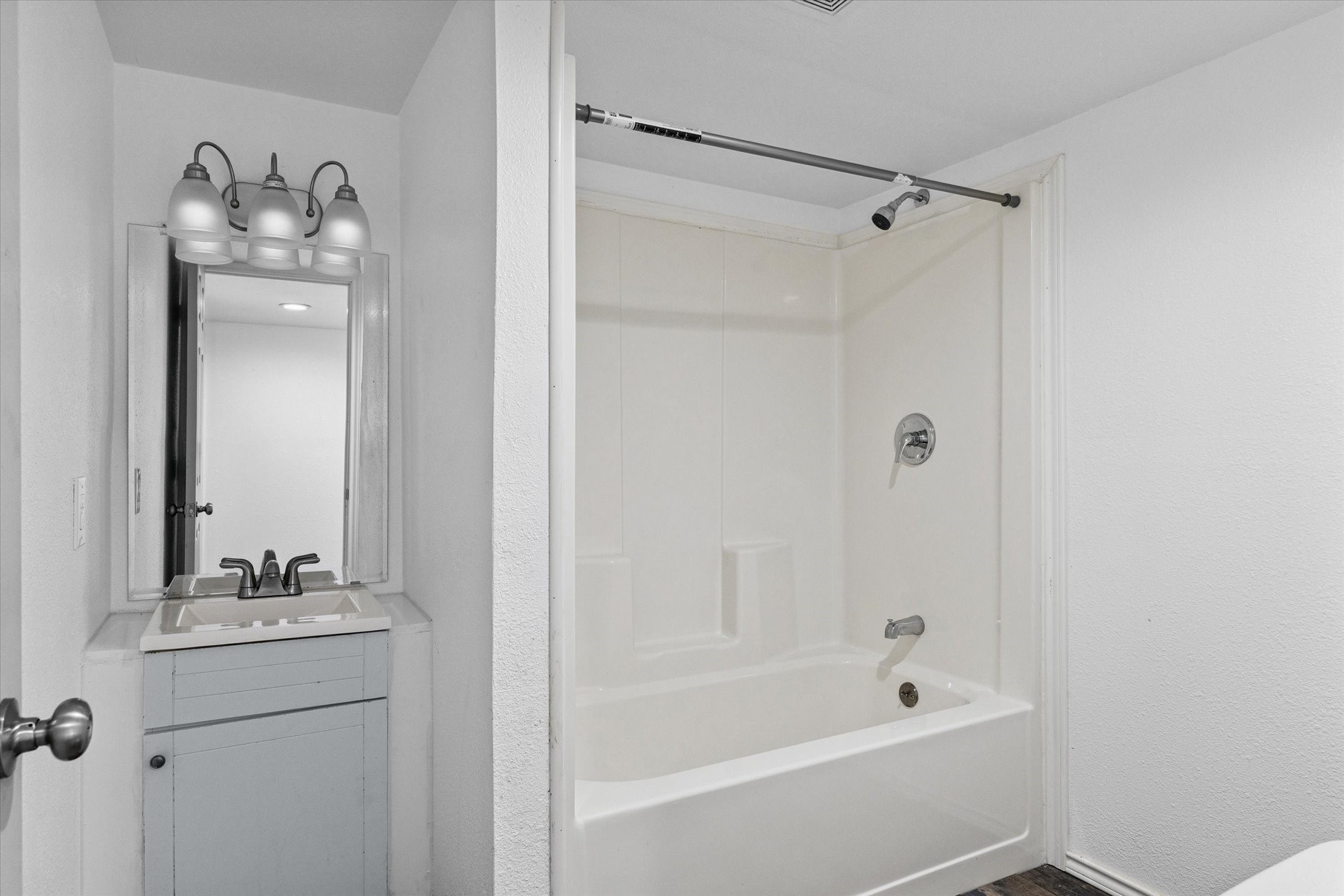 410 Pleasure Land Road Gun Barrel City, TX 75156 - Photo 28 of 33 a bathroom with a tub a sink and mirror