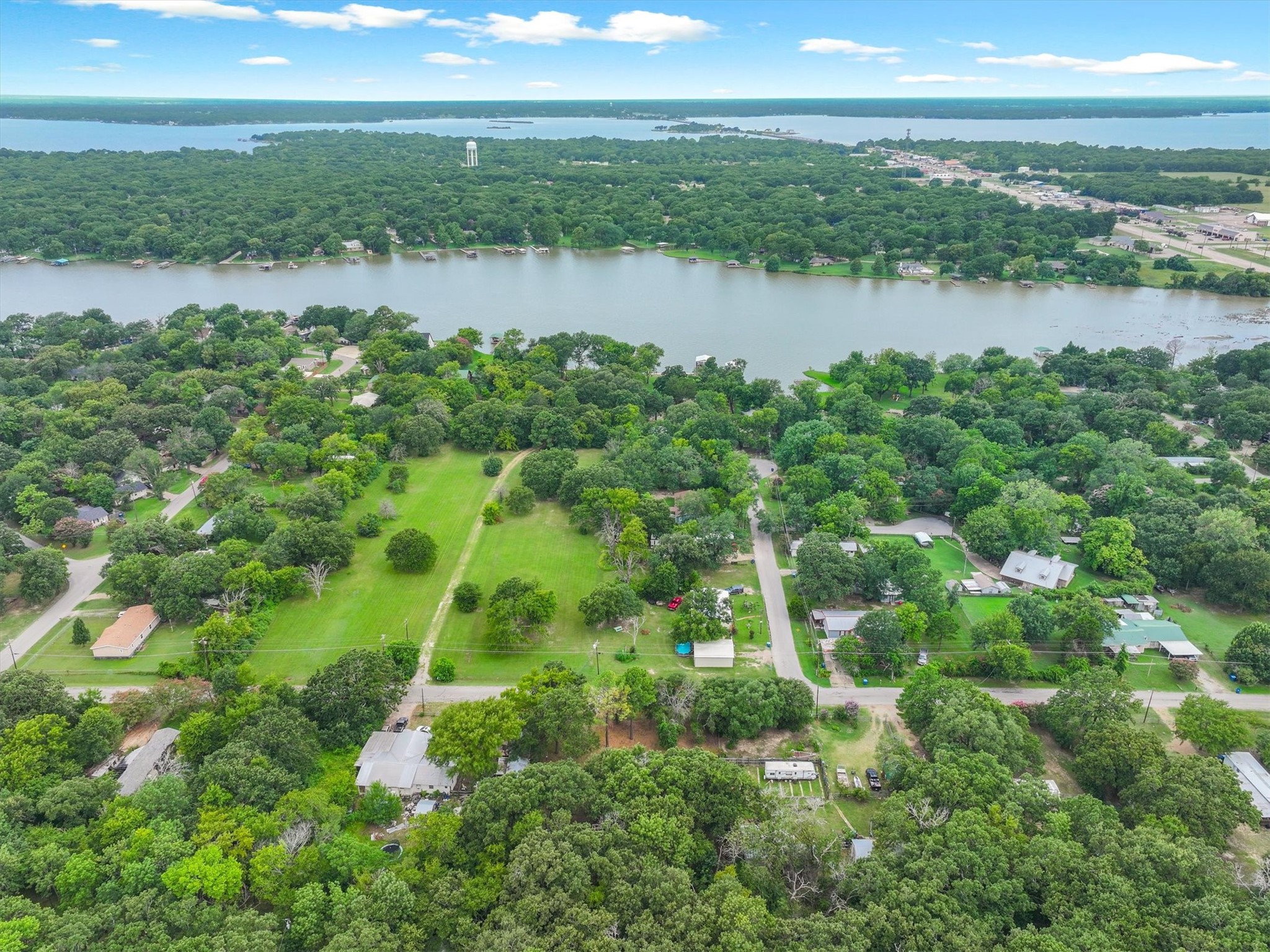 410 Pleasure Land Road Gun Barrel City, TX 75156 - Photo 3 of 33 a view of a lake with houses in the back