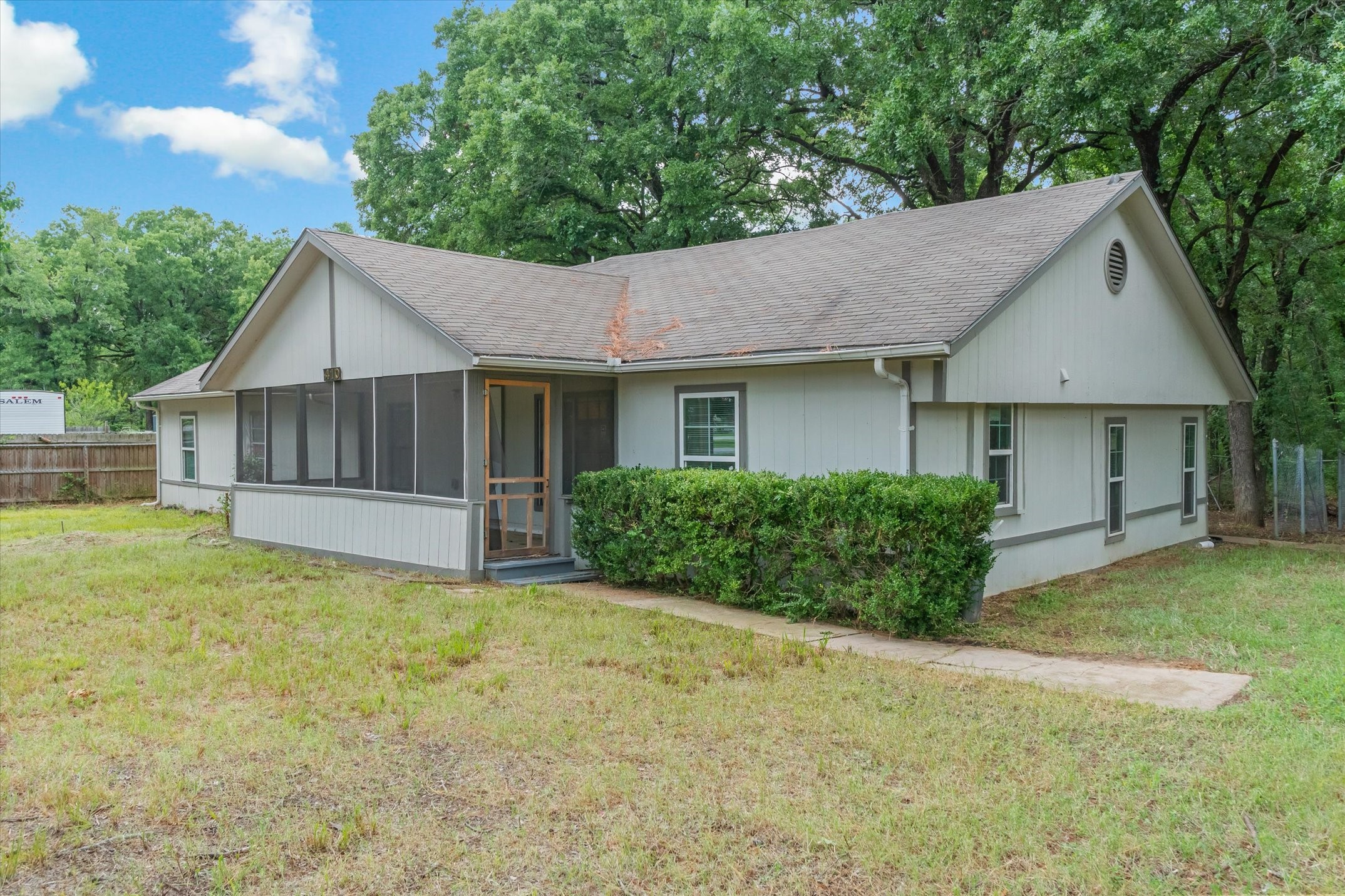 410 Pleasure Land Road Gun Barrel City, TX 75156 - Photo 9 of 33 a view of a house with a yard and a garden