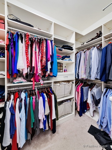 1453 West Irving Park Road, Unit 304 Chicago, IL 60613 - Photo 12 of 17 a view of walk in closet with clothes
