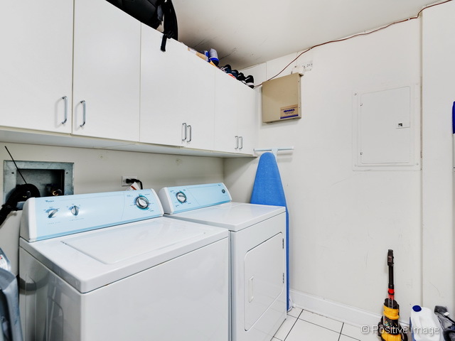 1453 West Irving Park Road, Unit 304 Chicago, IL 60613 - Photo 16 of 17 a utility room with dryer and washer