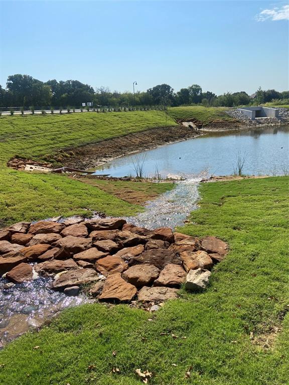 109 Park Avenue Keller, TX 76248 - Photo 1 of 3 a view of a lake with a city