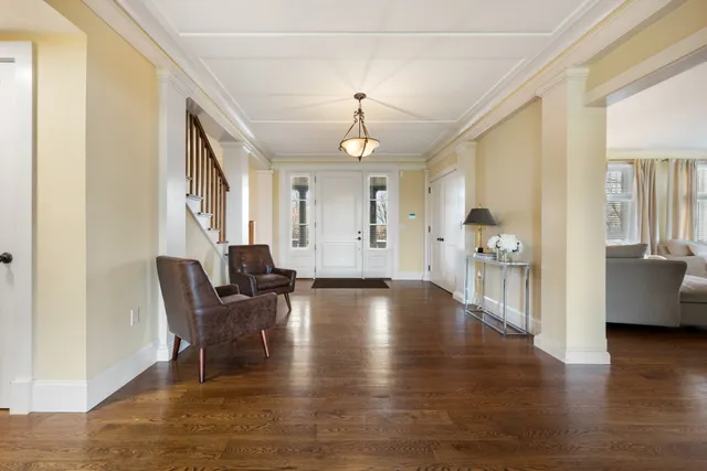 a view of a livingroom with furniture hardwood floor and a ceiling fan