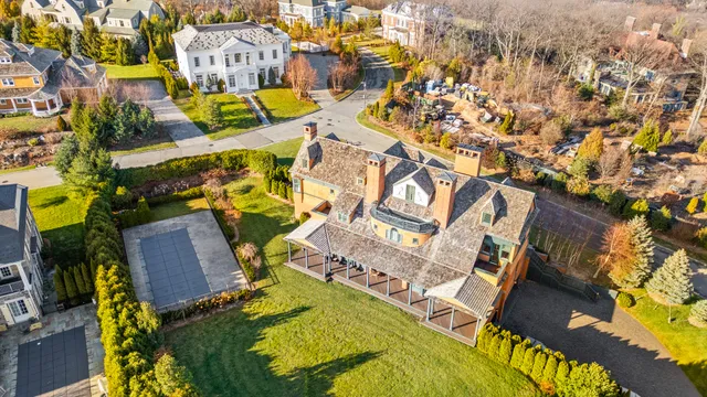 an aerial view of a house with a swimming pool