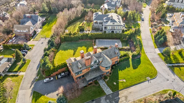 an aerial view of a house with a swimming pool