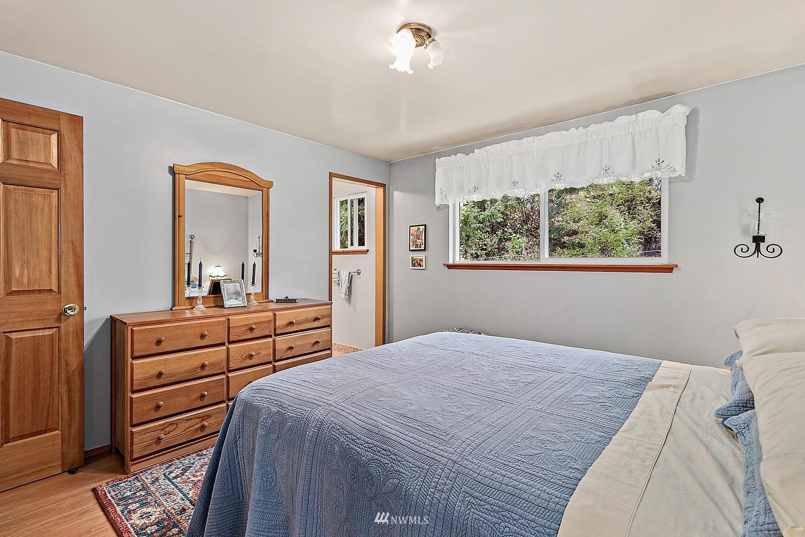 509 Roe Street Steilacoom, WA 98388 - Photo 13 of 40 a bedroom with a bed and a dresser