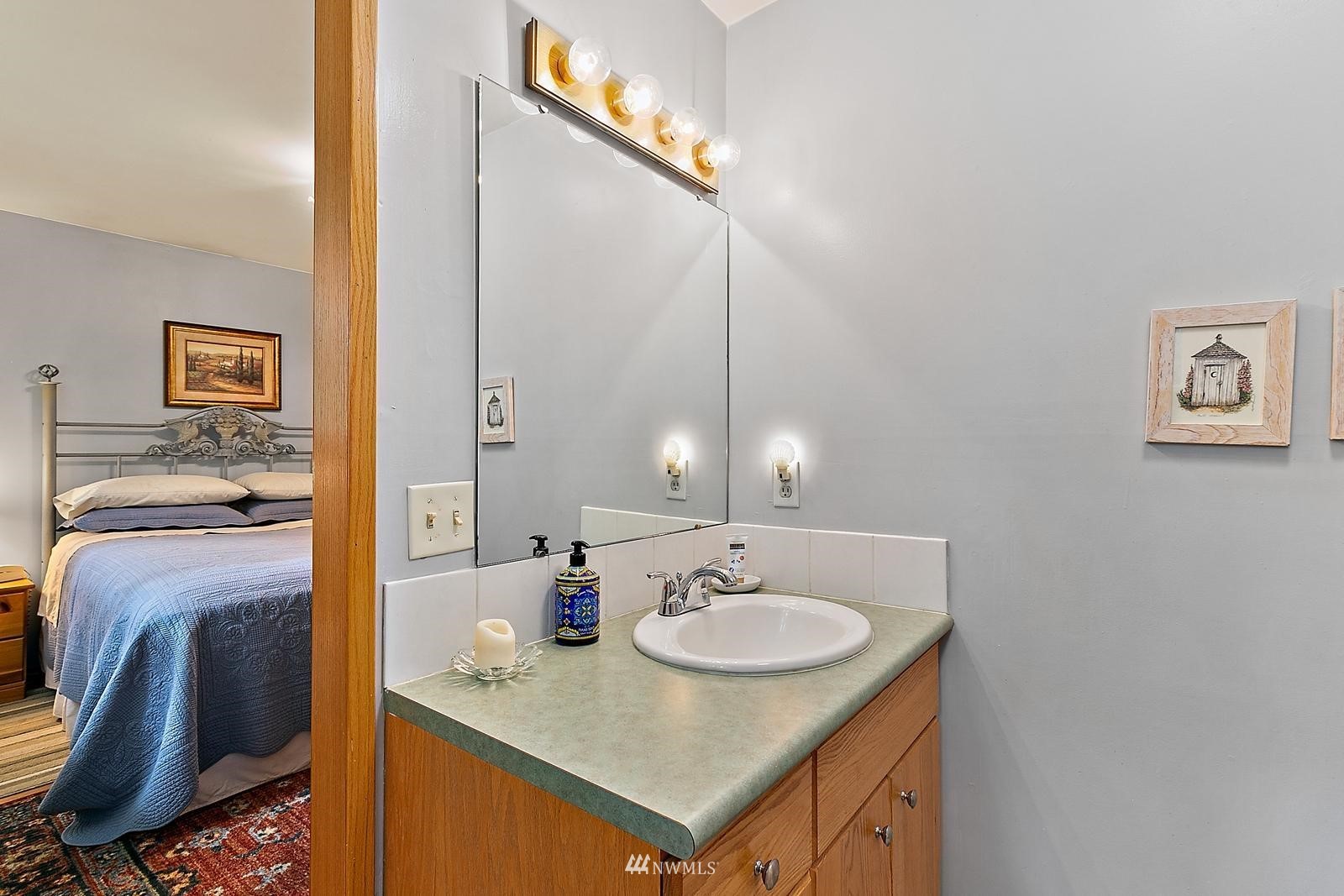 509 Roe Street Steilacoom, WA 98388 - Photo 18 of 40 a bathroom with a sink double vanity and a mirror