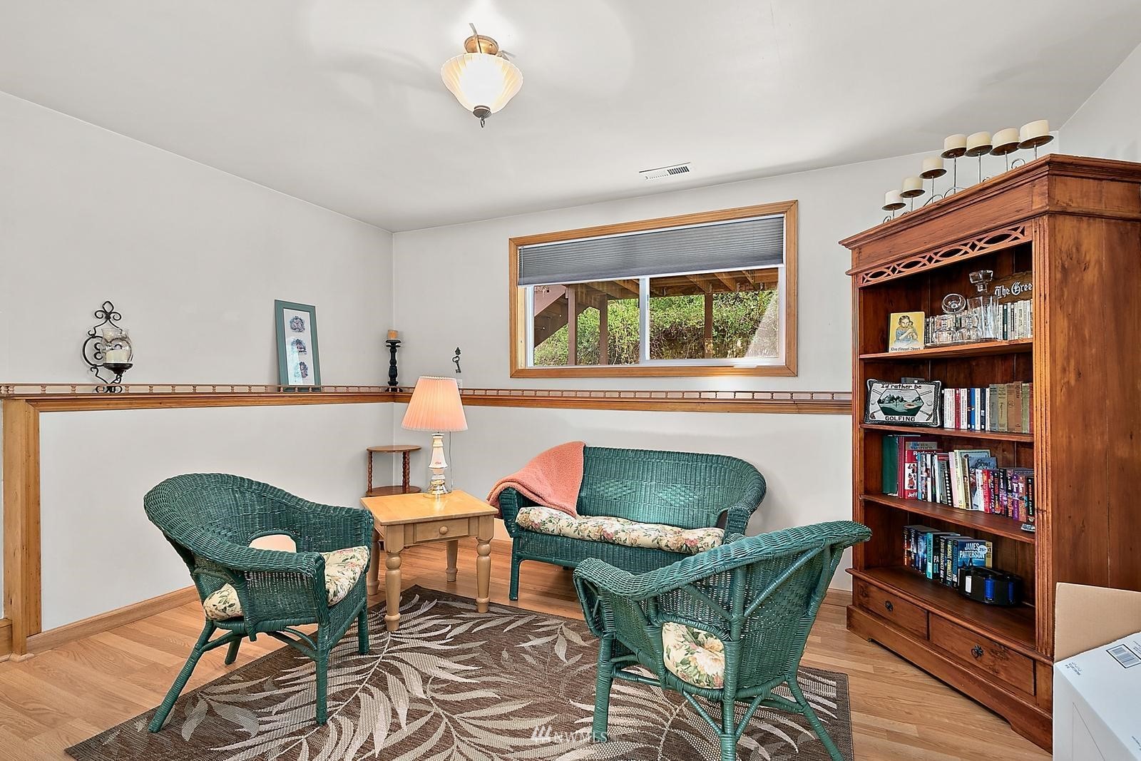 509 Roe Street Steilacoom, WA 98388 - Photo 25 of 40 a living room with furniture and a book shelf