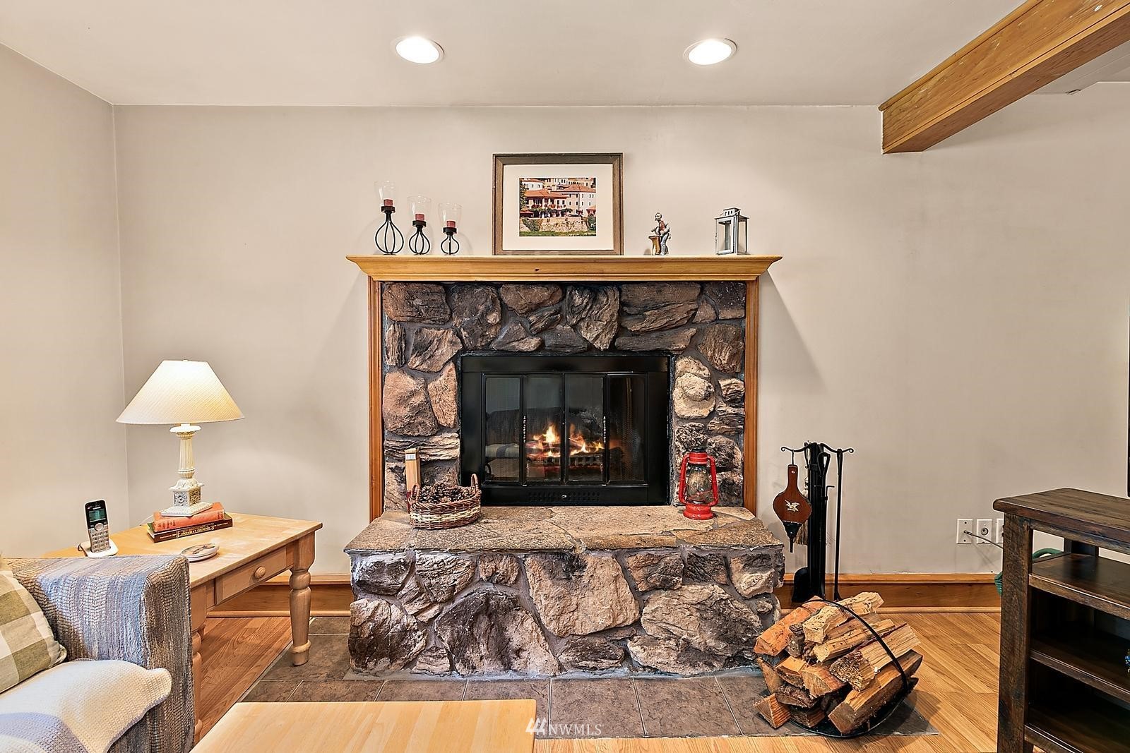 509 Roe Street Steilacoom, WA 98388 - Photo 26 of 40 a living room with furniture and a fireplace