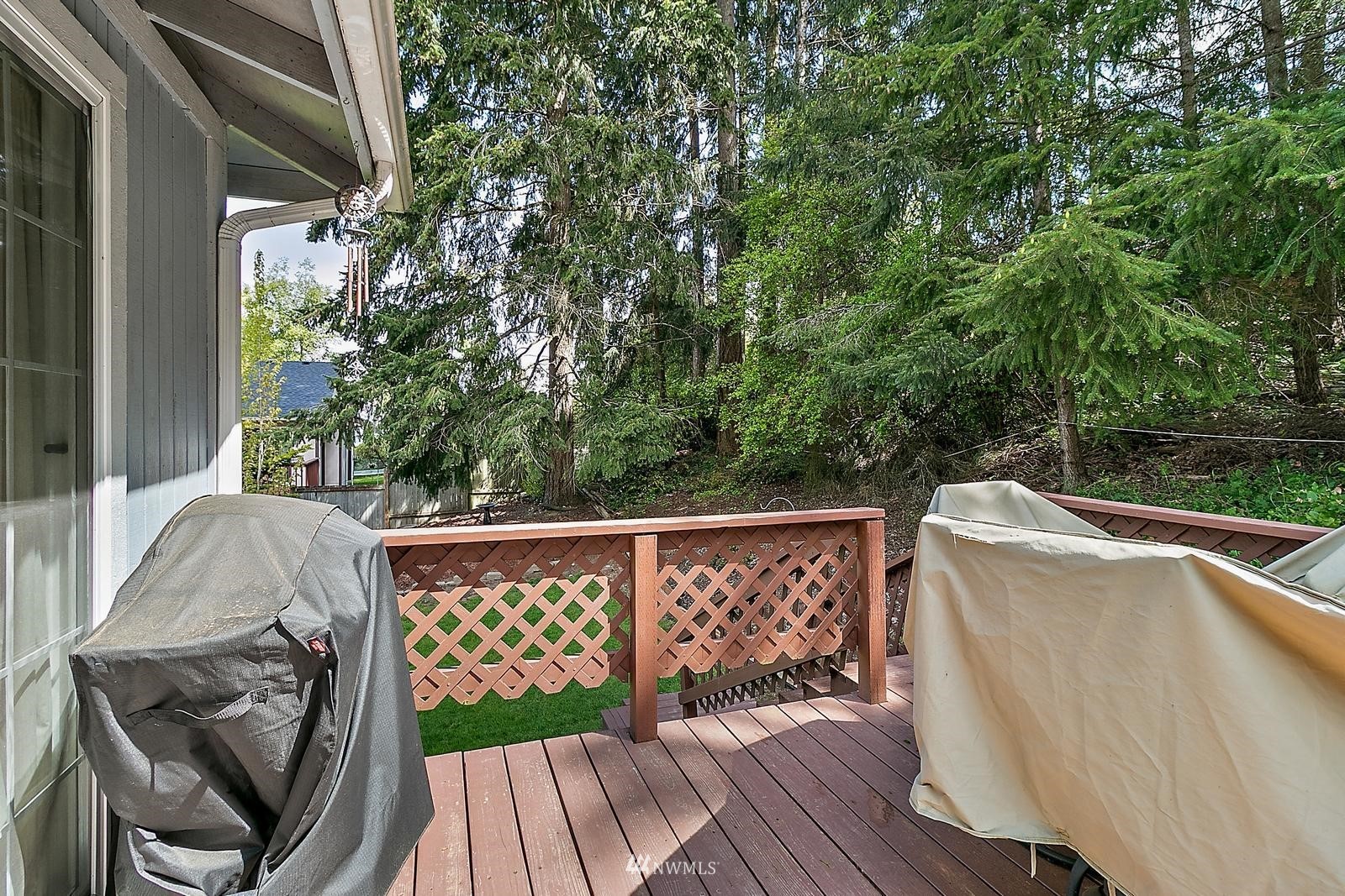 509 Roe Street Steilacoom, WA 98388 - Photo 30 of 40 a view of a wooden deck and a yard