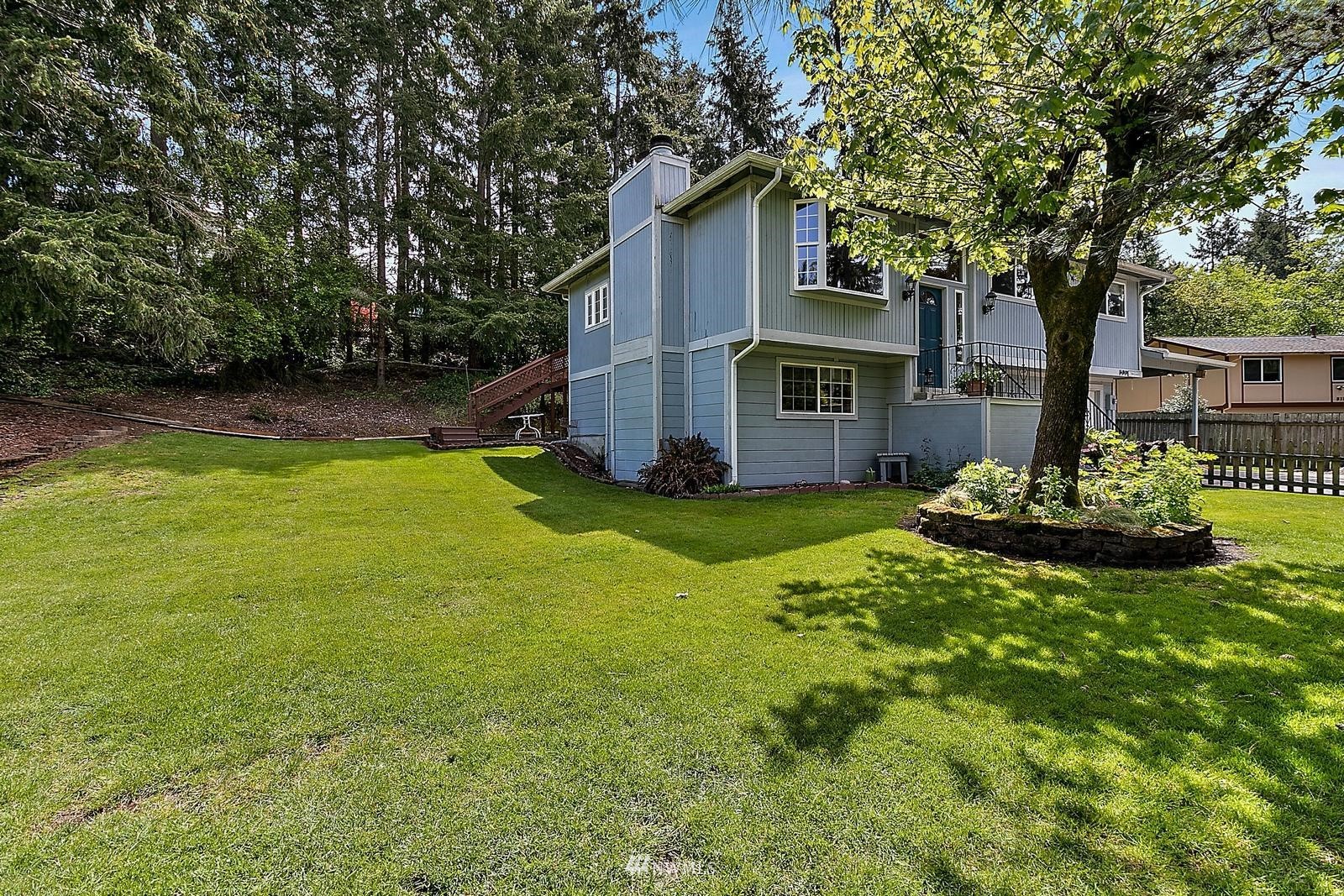 509 Roe Street Steilacoom, WA 98388 - Photo 33 of 40 a front view of house with yard and trees