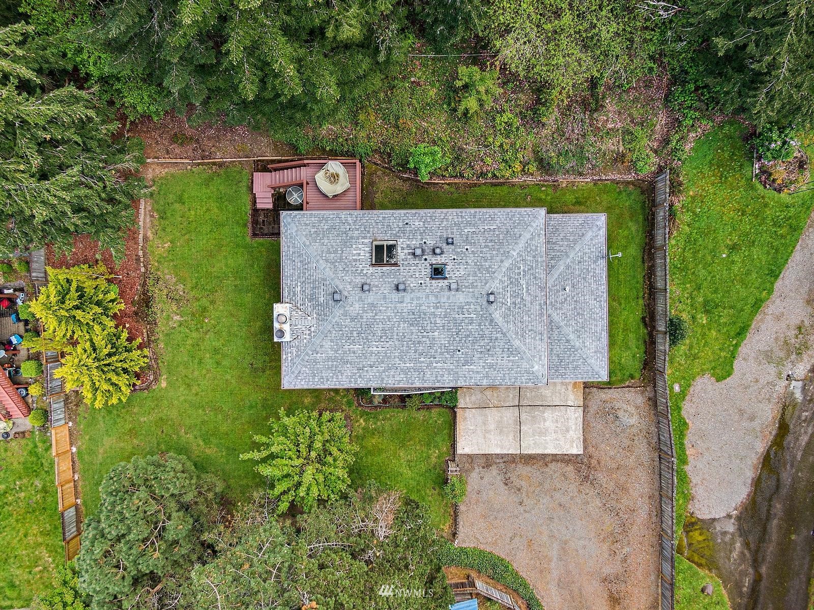 509 Roe Street Steilacoom, WA 98388 - Photo 34 of 40 an aerial view of a house with a yard and a large tree