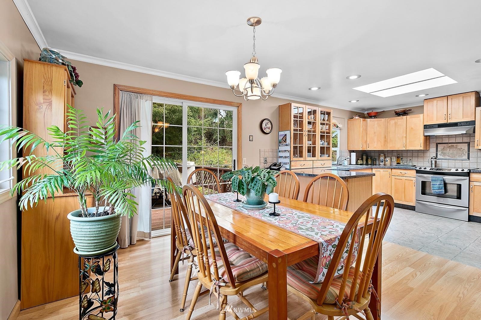 509 Roe Street Steilacoom, WA 98388 - Photo 5 of 40 a view of a dining room with furniture window and wooden floor