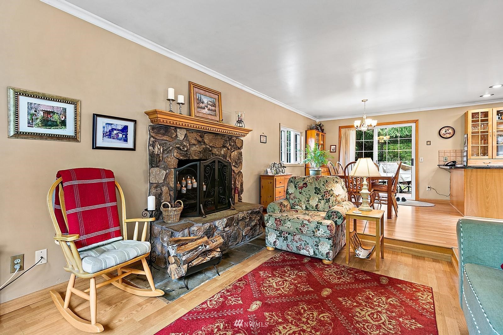 509 Roe Street Steilacoom, WA 98388 - Photo 6 of 40 a living room with furniture a rug and a flat screen tv