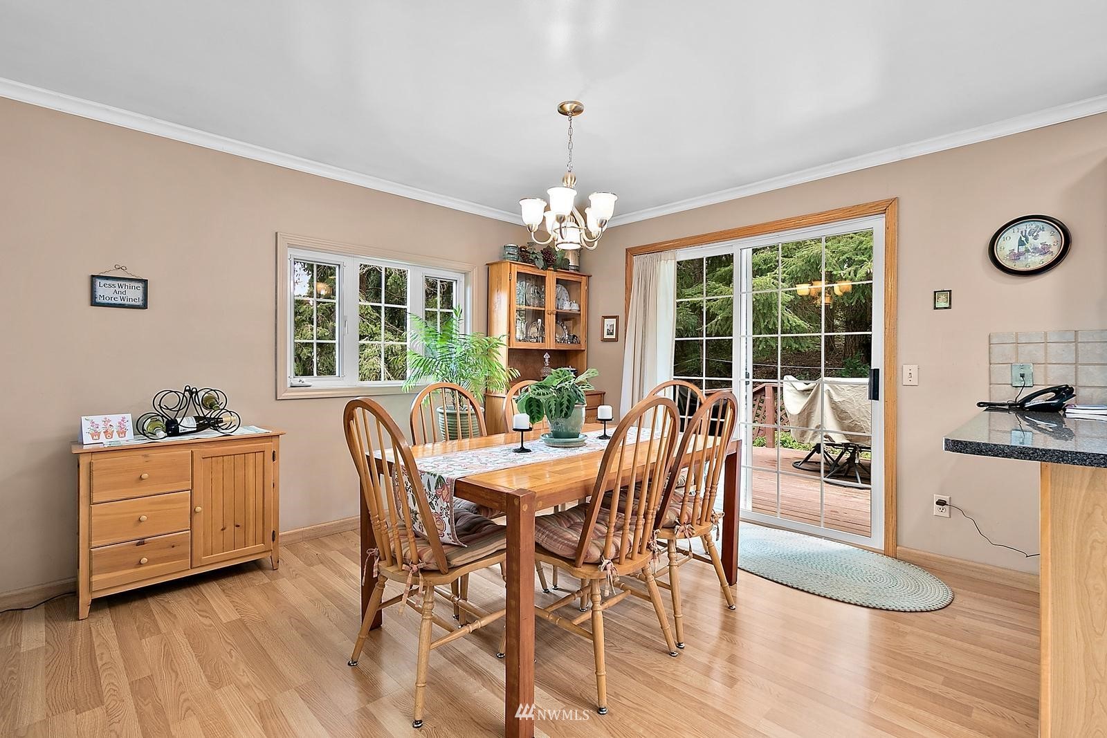 509 Roe Street Steilacoom, WA 98388 - Photo 9 of 40 a dining room with furniture a chandelier and wooden floor