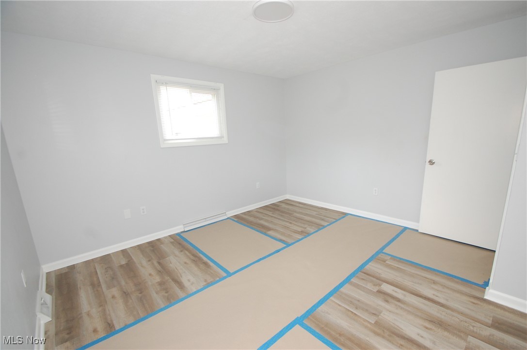 6284 Herbert Road Canfield, OH 44406 - Photo 17 of 24 Spare room featuring baseboards and wood finished floors