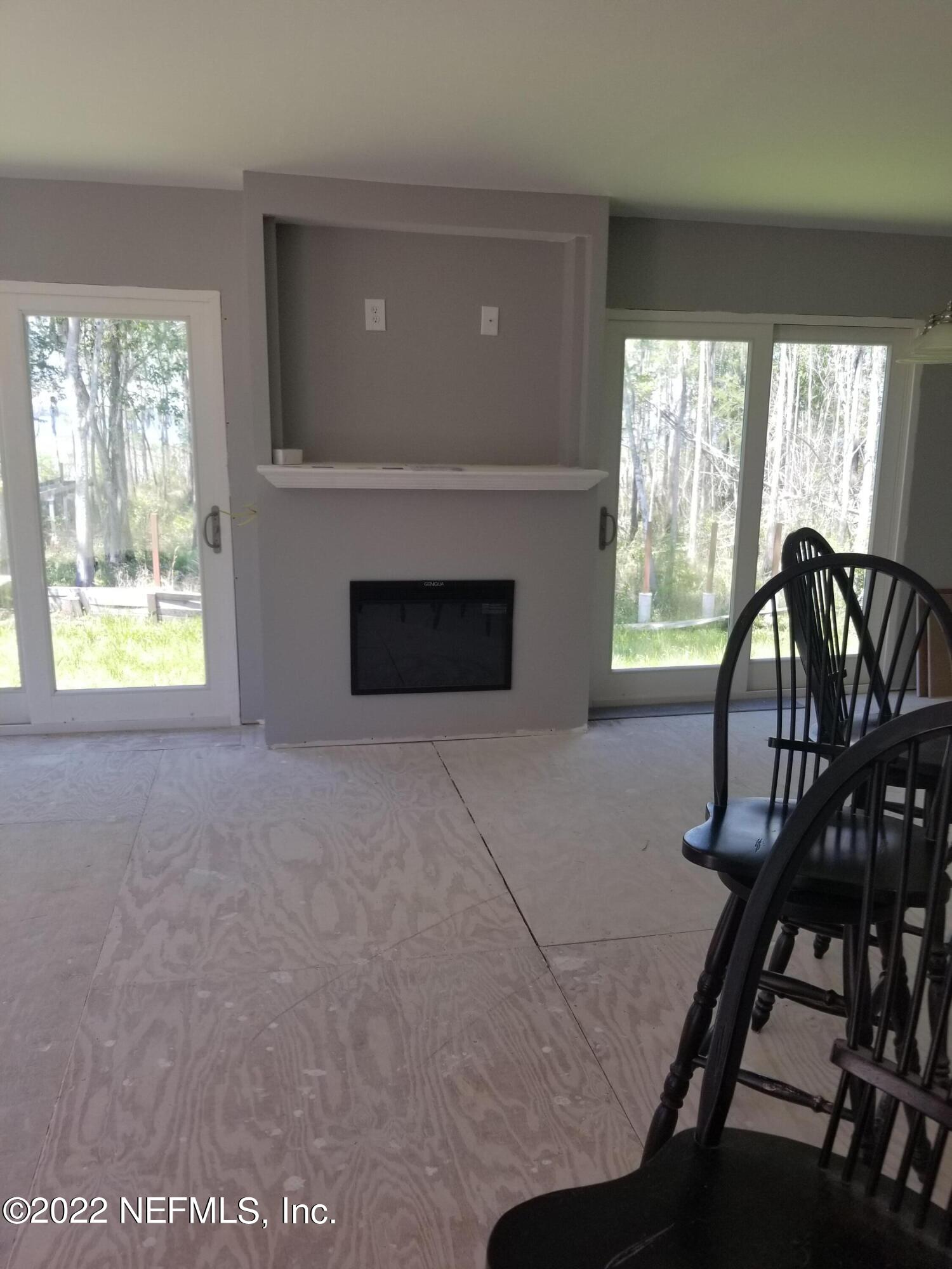 8505 Southwest 137th Street Starke, FL 32091 - Photo 4 of 10 a view of a livingroom with furniture and windows