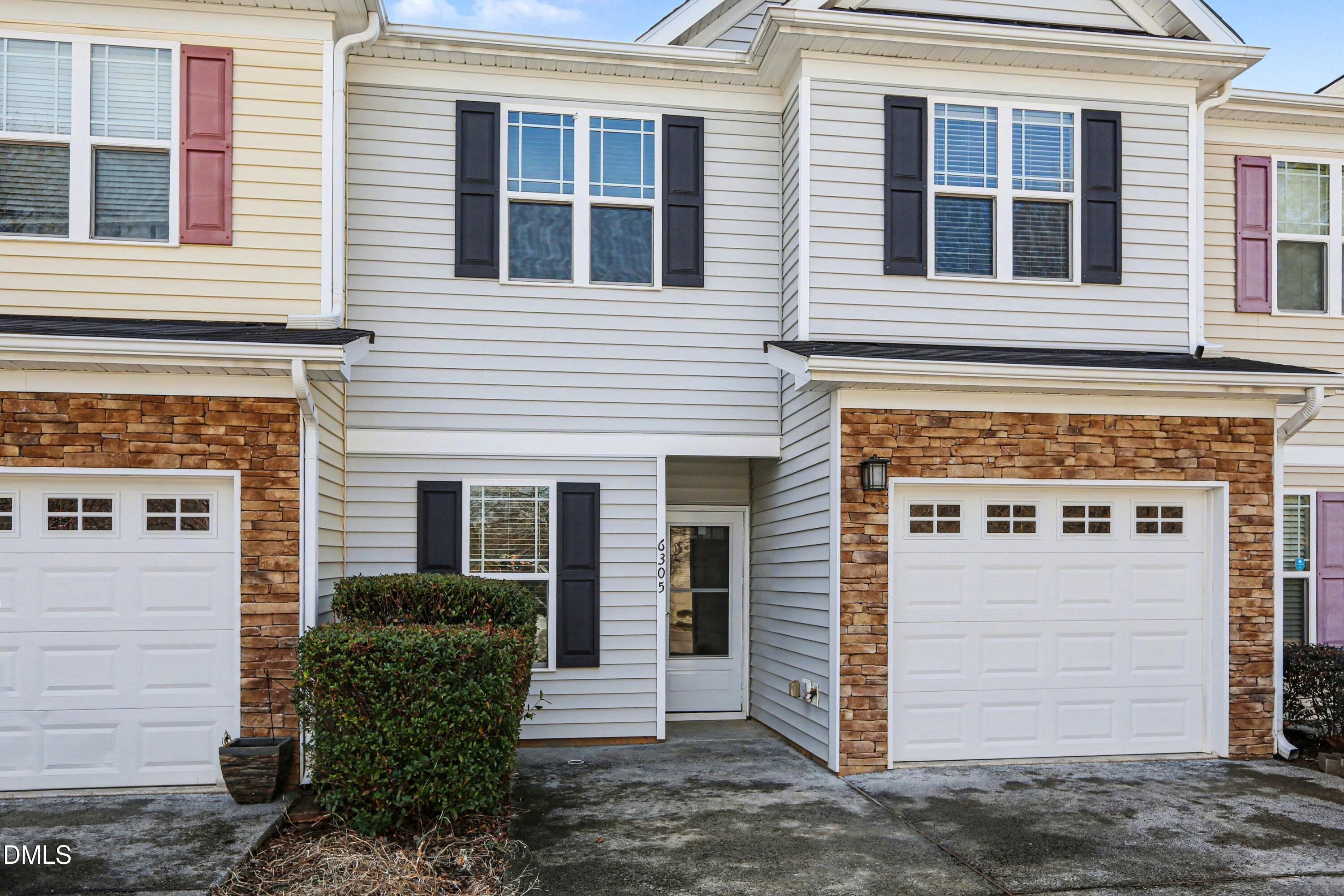 a front view of a house with a garage