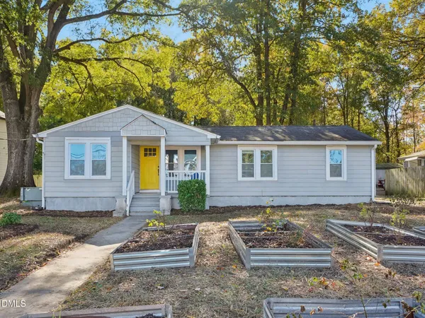 front view of a house with a yard