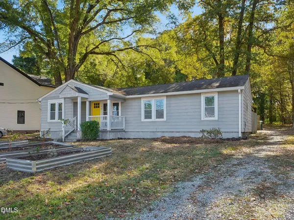 a front view of a house with yard