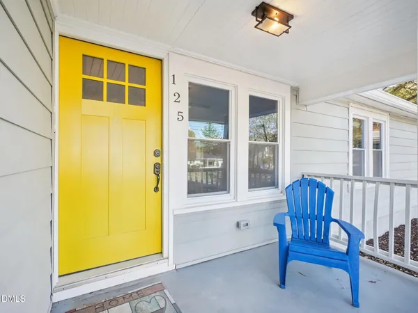 a view of porch with a chair and couch