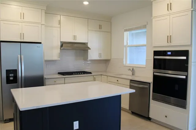 a bathroom with a granite countertop sink toilet a mirror and shower